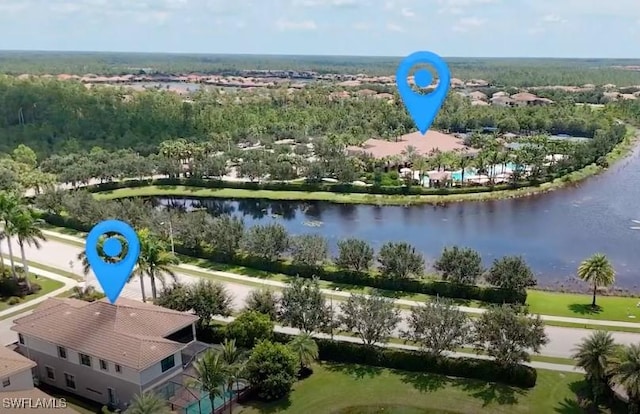 birds eye view of property with a water view