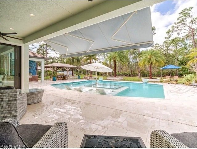 view of swimming pool featuring a gazebo and a patio