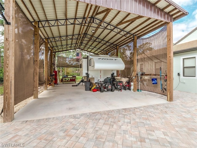 view of vehicle parking featuring a carport