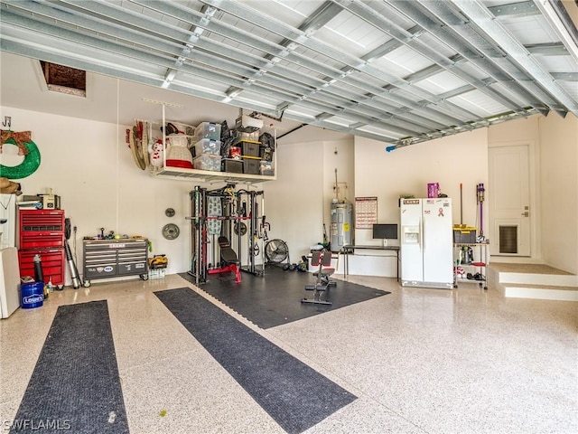 garage with white fridge with ice dispenser and water heater