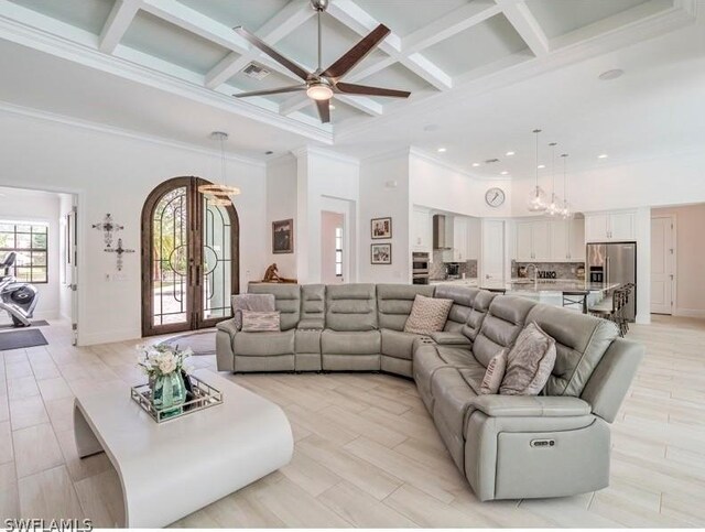 living room featuring a high ceiling, french doors, coffered ceiling, ceiling fan, and beam ceiling