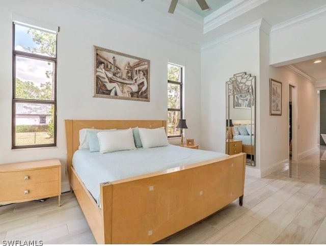 bedroom featuring ceiling fan and crown molding