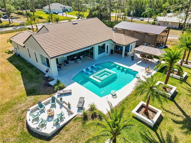 view of swimming pool featuring a gazebo, an outdoor living space, a patio, and a lawn