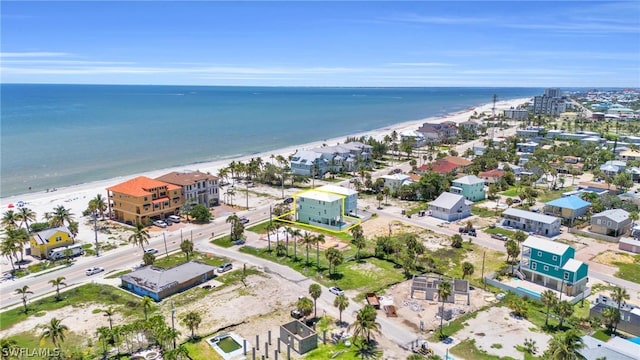 aerial view featuring a view of the beach and a water view