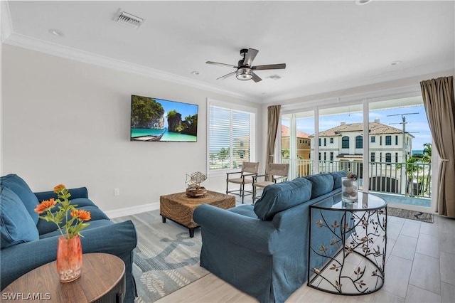 living room with ceiling fan and ornamental molding