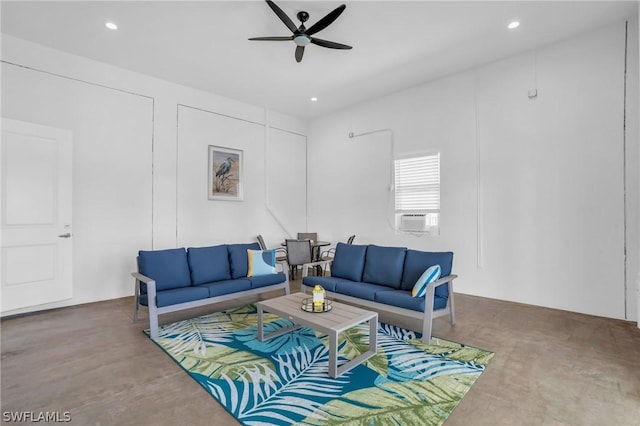 living room featuring ceiling fan and cooling unit