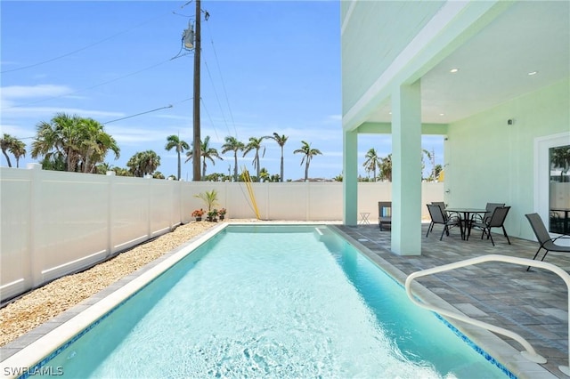 view of swimming pool with a patio area