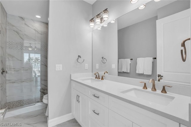 bathroom featuring vanity, an enclosed shower, and toilet