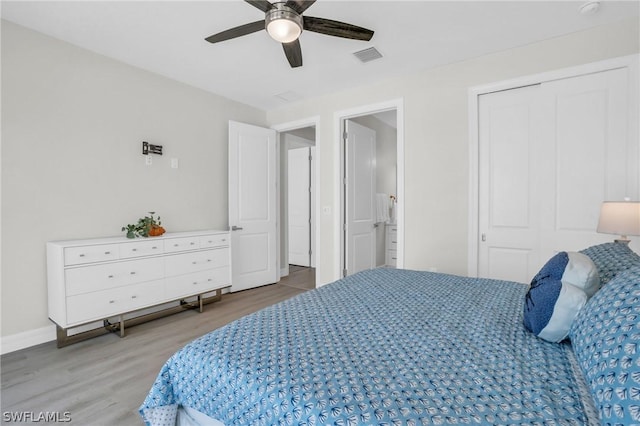 bedroom featuring ceiling fan, wood-type flooring, and a closet