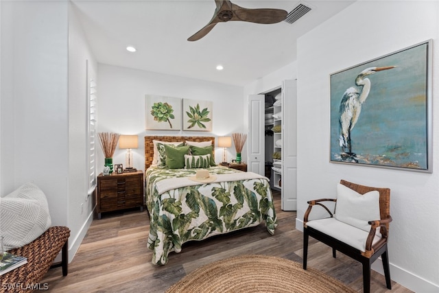 bedroom featuring ceiling fan and hardwood / wood-style floors