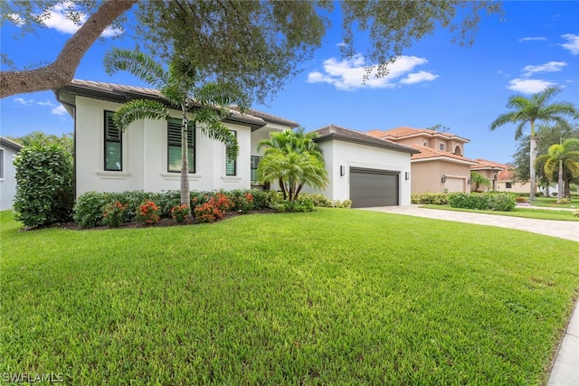 view of front facade featuring a garage and a front lawn