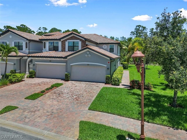 view of front of house with a garage and a front yard