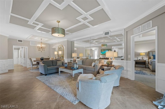 tiled living room with crown molding, coffered ceiling, and an inviting chandelier