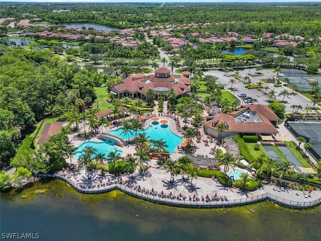 birds eye view of property with a water view