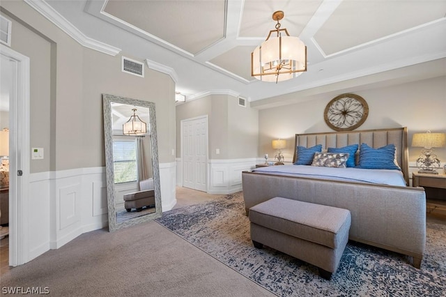 bedroom featuring coffered ceiling, ornamental molding, carpet floors, and an inviting chandelier