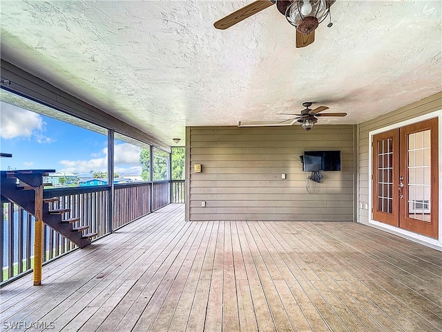 wooden deck with french doors and ceiling fan