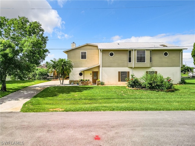 view of front of home with a front yard