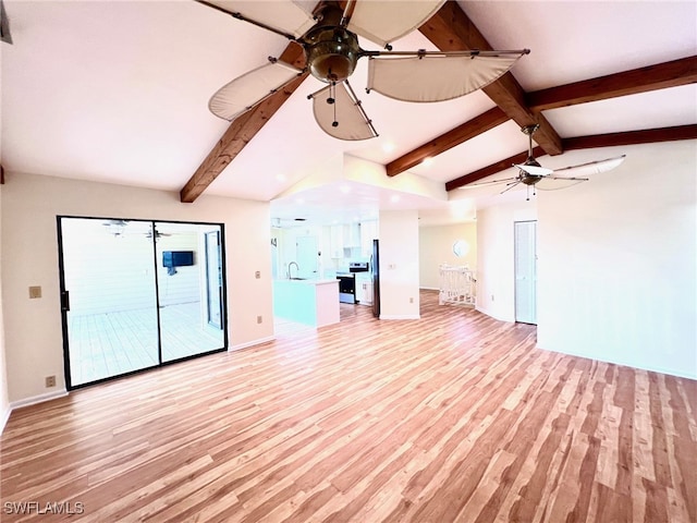 unfurnished living room featuring sink, light hardwood / wood-style flooring, vaulted ceiling with beams, and ceiling fan