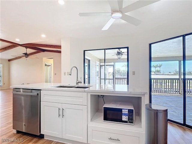 24313 Pirate Harbor Blvd, Punta Gorda, FL 33955 - kitchen with dishwasher, ceiling fan, a sink, and light countertops