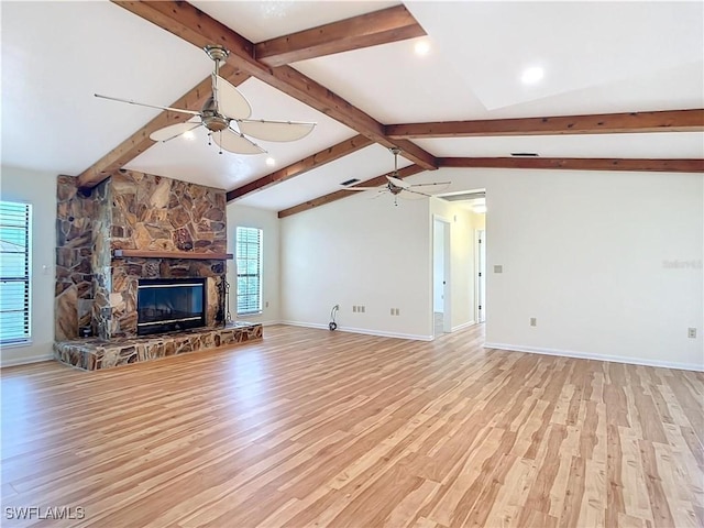 24313 Pirate Harbor Blvd, Punta Gorda, FL 33955 - unfurnished living room with light wood-type flooring, a wealth of natural light, a ceiling fan, and baseboards