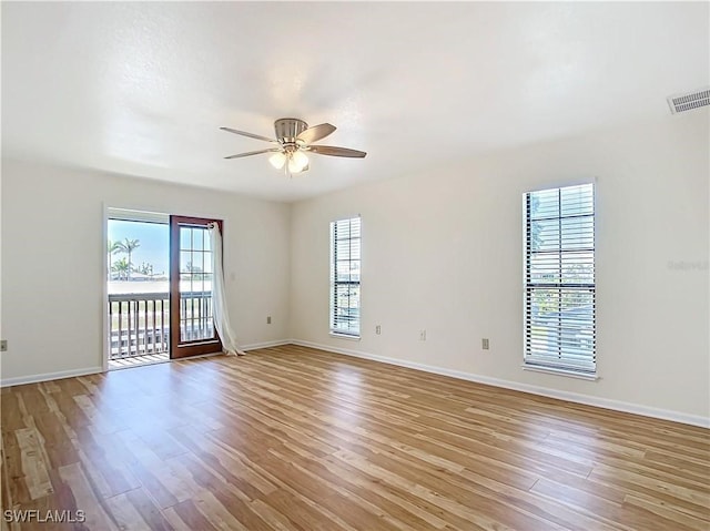 24313 Pirate Harbor Blvd, Punta Gorda, FL 33955 - empty room with light wood-type flooring, baseboards, visible vents, and ceiling fan