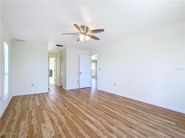 24313 Pirate Harbor Blvd, Punta Gorda, FL 33955 - unfurnished room featuring light wood-type flooring, visible vents, a ceiling fan, and baseboards