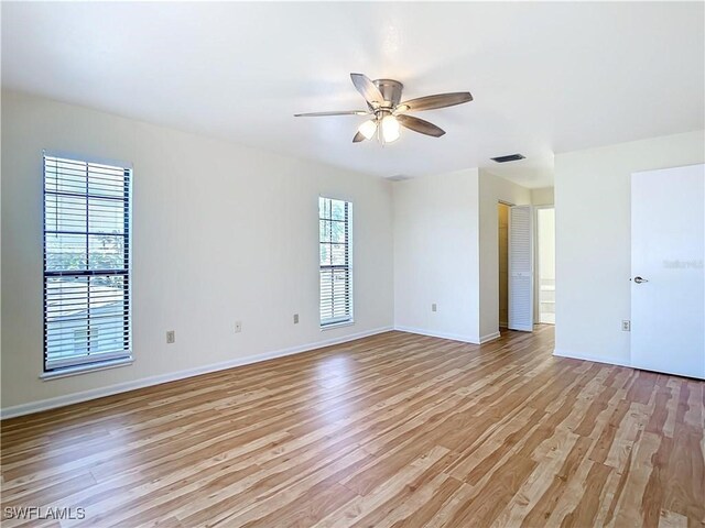 24313 Pirate Harbor Blvd, Punta Gorda, FL 33955 - unfurnished room featuring light wood finished floors, baseboards, visible vents, and ceiling fan
