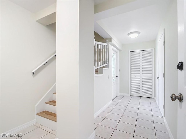 24313 Pirate Harbor Blvd, Punta Gorda, FL 33955 - interior space featuring baseboards, stairs, and light tile patterned floors