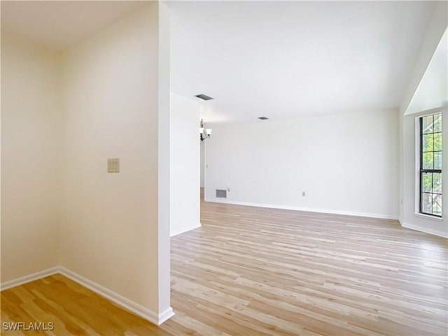 24313 Pirate Harbor Blvd, Punta Gorda, FL 33955 - unfurnished room with baseboards, visible vents, and light wood finished floors