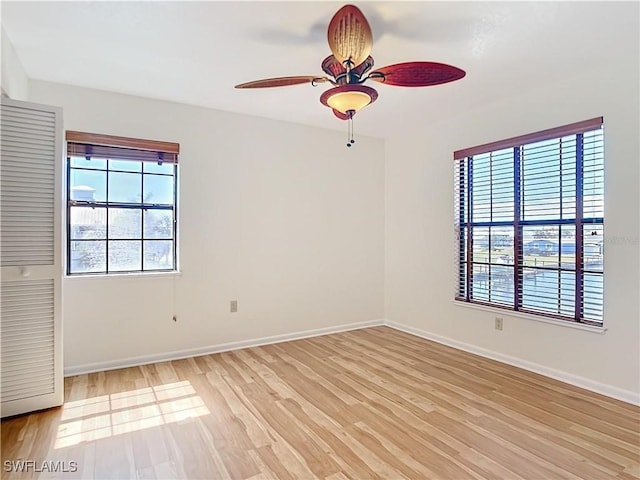24313 Pirate Harbor Blvd, Punta Gorda, FL 33955 - empty room with light wood-type flooring, a ceiling fan, and baseboards