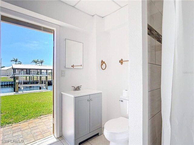 24313 Pirate Harbor Blvd, Punta Gorda, FL 33955 - full bath with toilet, vanity, and a water view