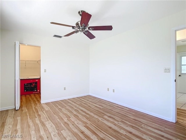 24313 Pirate Harbor Blvd, Punta Gorda, FL 33955 - spare room featuring baseboards, a ceiling fan, light wood finished floors, and visible vents