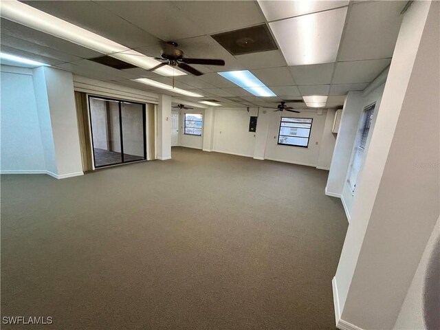 24313 Pirate Harbor Blvd, Punta Gorda, FL 33955 - below grade area with dark colored carpet, a drop ceiling, baseboards, and ceiling fan