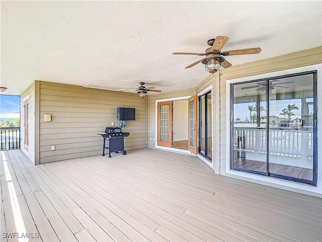24313 Pirate Harbor Blvd, Punta Gorda, FL 33955 - wooden deck with grilling area and ceiling fan