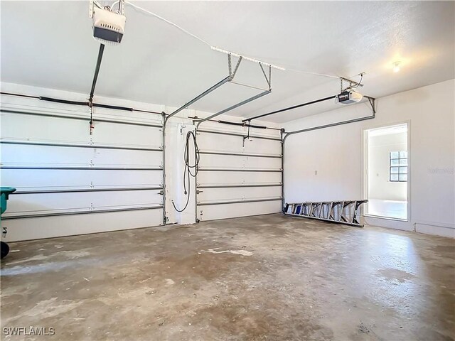 24313 Pirate Harbor Blvd, Punta Gorda, FL 33955 - garage featuring a garage door opener