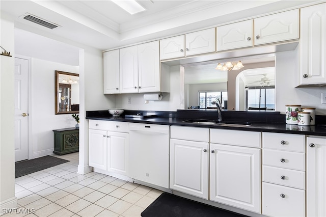 kitchen featuring visible vents, white cabinets, dishwasher, dark countertops, and a sink