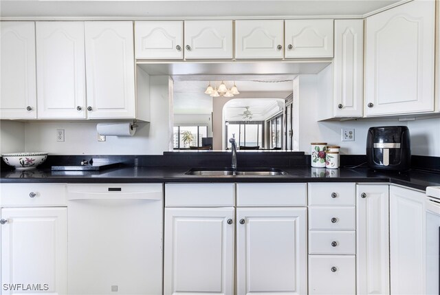 kitchen featuring white cabinets, sink, and white dishwasher