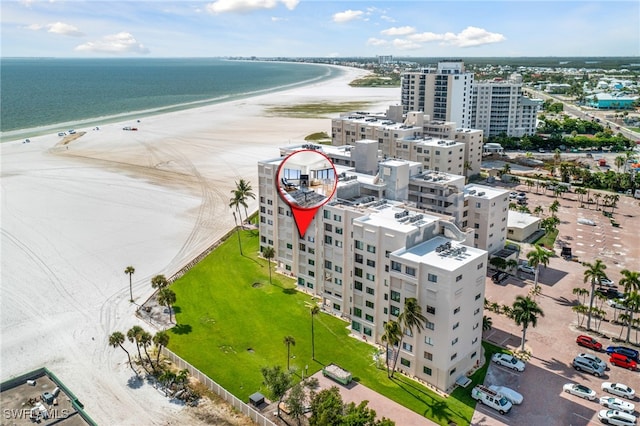 bird's eye view with a beach view and a water view