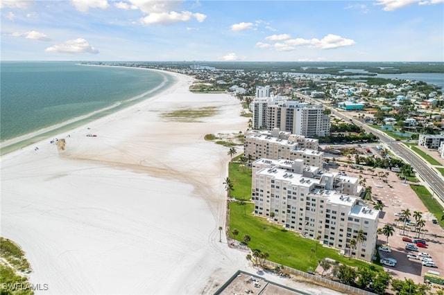 aerial view featuring a view of the beach, a city view, and a water view