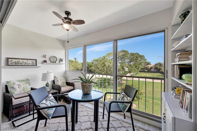 sunroom / solarium with ceiling fan