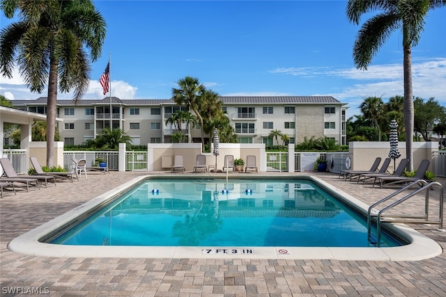 view of swimming pool with a patio