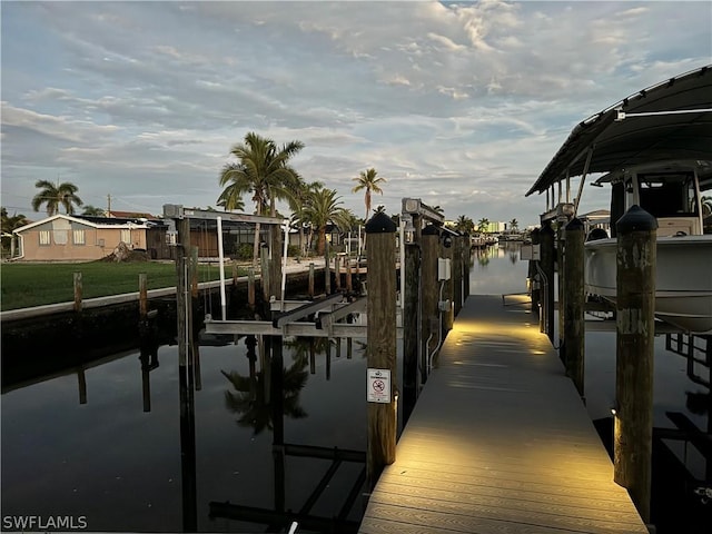 dock area featuring a water view and boat lift