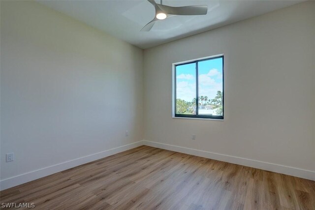 spare room featuring ceiling fan and light hardwood / wood-style flooring