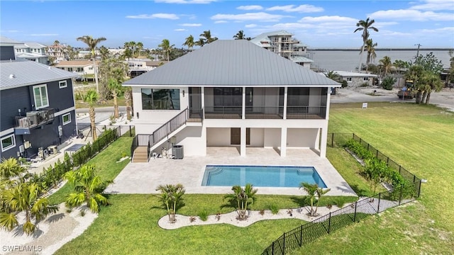 rear view of house with central air condition unit, a water view, a sunroom, a fenced in pool, and a patio