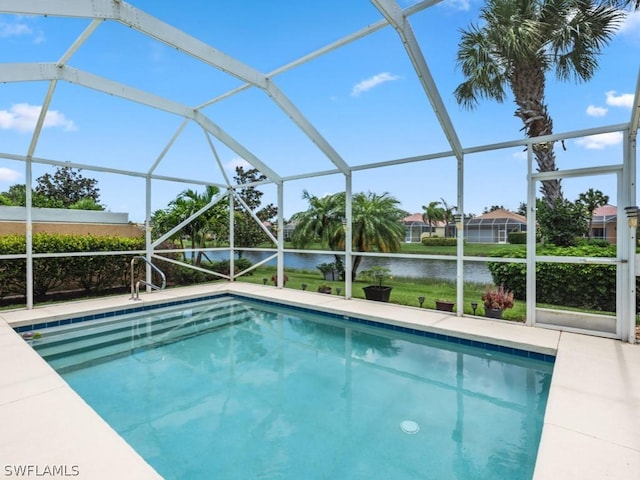 view of pool featuring a lanai and a water view