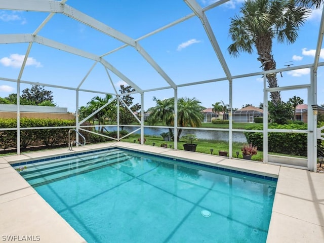 view of swimming pool with a lanai and a water view