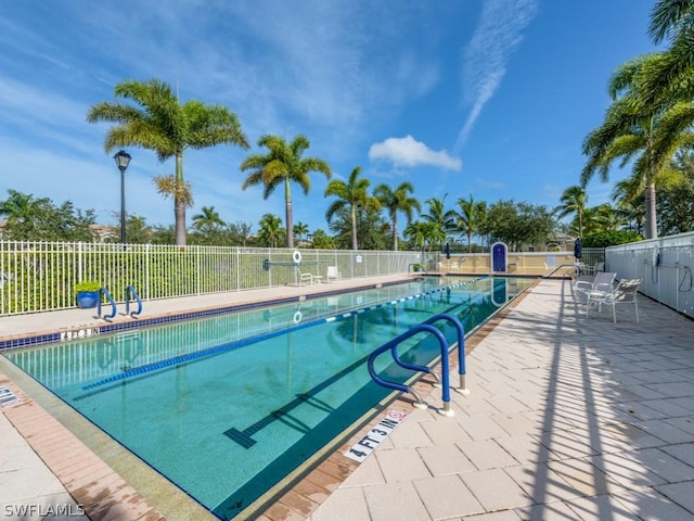 view of swimming pool with a patio