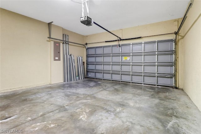 garage with electric panel and a garage door opener