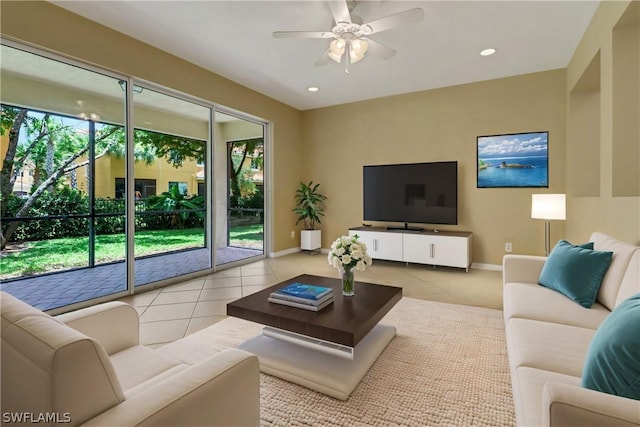 tiled living room featuring recessed lighting, ceiling fan, and baseboards