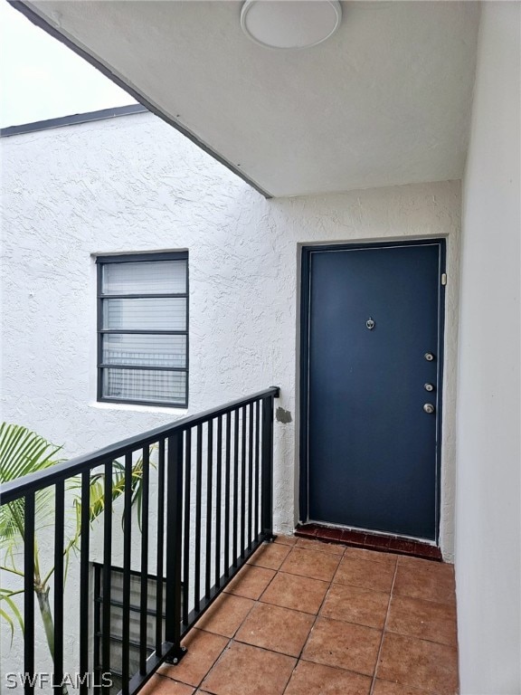 property entrance with a balcony